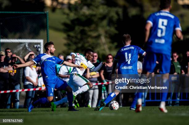 Ibrahima Traore of Borussia Moenchengladbach and Jan Kirchhoff of 1. FC Magdeburg battle for the ball during the friendly match between Borussia...