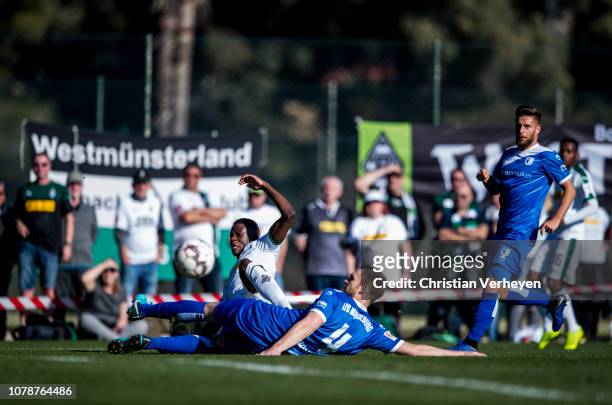 Denis Zakaria of Borussia Moenchengladbach and Jan Kirchhoff of 1. FC Magdeburg battle for the ball during the friendly match between Borussia...