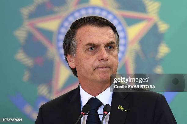 Brazilian President Jair Bolsonaro delivers a speech during the appointment ceremony of the new heads of public banks, at Planalto Palace in Brasilia...