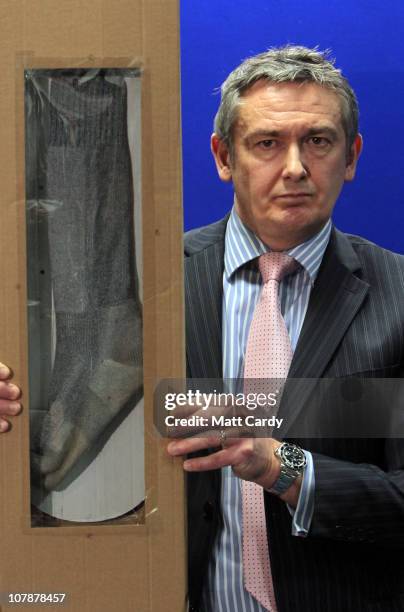 Senior Investigating Officer Phil Jones displays a sock similar to the one Joanna Yeates was wearing when she was found, at a press conference on...