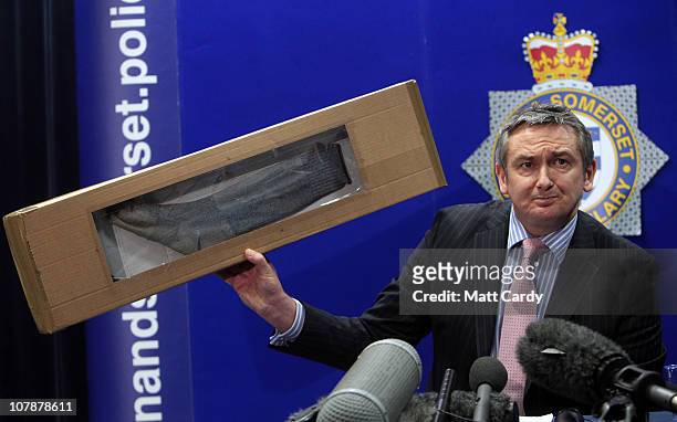Senior Investigating Officer Phil Jones displays a sock similar to the one Joanna Yeates was wearing when she was found at a press conference on...