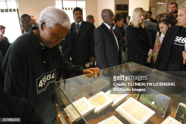 July 2004: Former President Nelson Mandela, looks at some of his personal letters written during his imprisonment to the prison authorities at the...