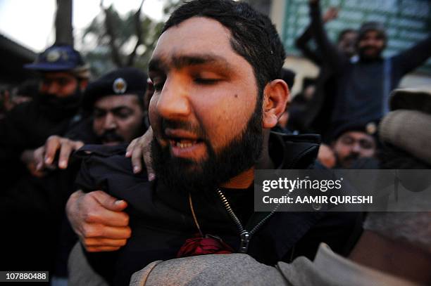 Arrested Pakistani bodyguard Malik Mumtaz Hussain Qadri leaves after appearing in court in Islamabad on January 5, 2011 a day after the assassination...