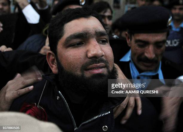 Arrested Pakistani bodyguard Malik Mumtaz Hussain Qadri leaves after appearing in court in Islamabad on January 5, 2011 a day after the assassination...