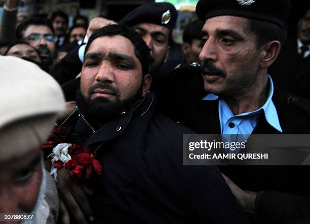 Arrested Pakistani bodyguard Malik Mumtaz Hussain Qadri leaves after appearing in court in Islamabad on January 5, 2011 a day after the assassination...