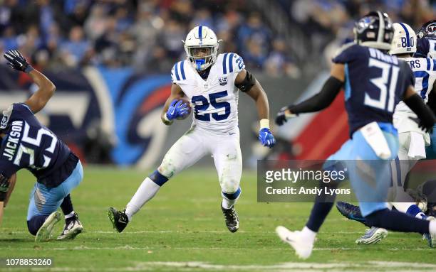Marlon Mack of the Indianapolis Colts runs with the ball against the Tennessee Titans at Nissan Stadium on December 30, 2018 in Nashville, Tennessee.