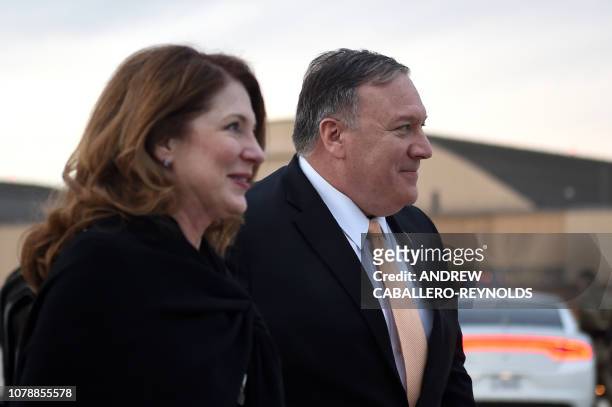 Secretary of State Mike Pompeo and wife Susan Pompeo walk to the plane prior to departing from Joint Base Andrews on January 7, 2019. - Pompeo will...