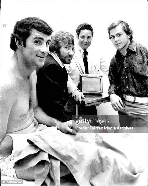 Eastern Suburbs Rugby league player Jim Morgan and and fellow players Peter Moscatt Don Furner and John Ballesty watch a replay of Saturdays game on...
