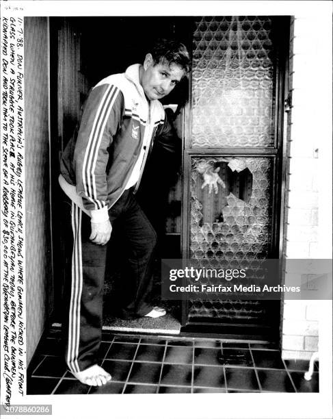 Don Furner Australian Rugby League coach shows where gunmen kicked in his front glass when a struggle took place at his home in Queanbeyan today....