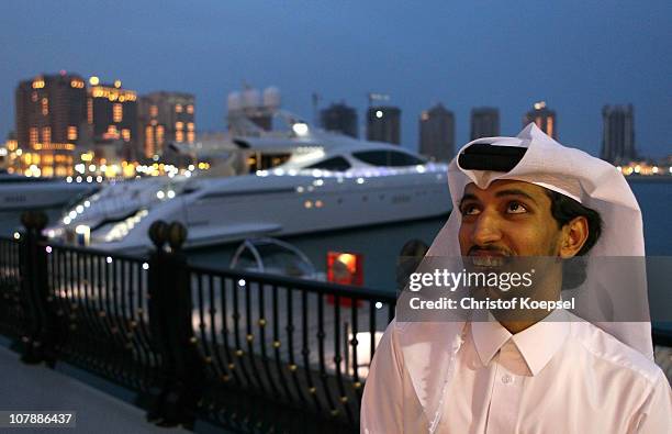 Qatarian is seen in front of the Pearl area with yachts on January 5, 2011 in Doha, Qatar. The International Monetary Fund recently reiterated its...