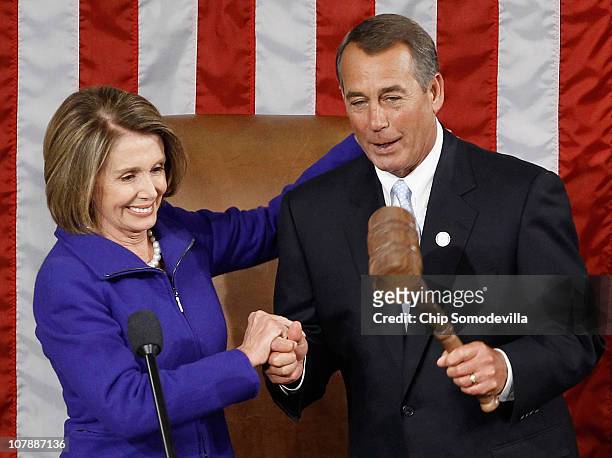 Speaker of the House John Boehner receives the Speaker's gavel from outgoing Speaker of the House Nancy Pelosi January 5, 2011 in Washington, DC. The...