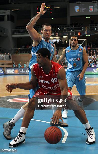 Joseph Buck of Duesseldorf challenges Kyle Hines of Brose during the Beko Basketball Bundesliga match between Gloria Giants Duesseldorf and Brose...