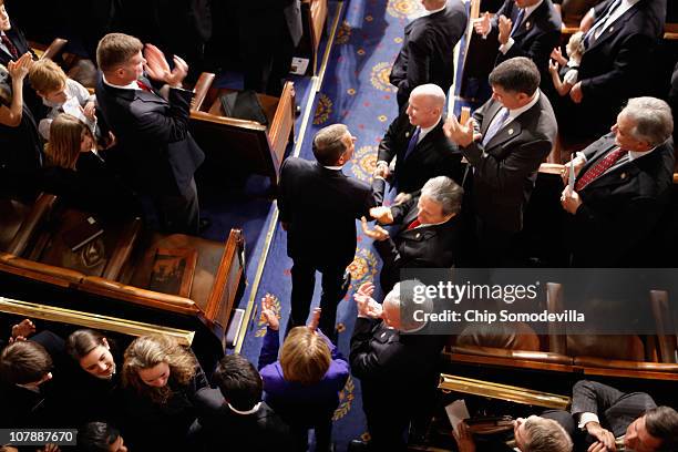 Speaker of the House John Boehner is congratulated by colleagues while entering the House chamber following his election January 5, 2011 in...