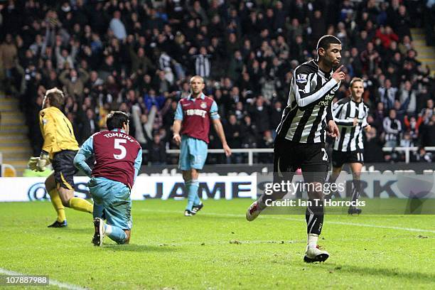 Leon Best of Newcastle United celebrates scoring the opening goal with Kevin Nolan and joey Barton during the Barclays Premier League game between...