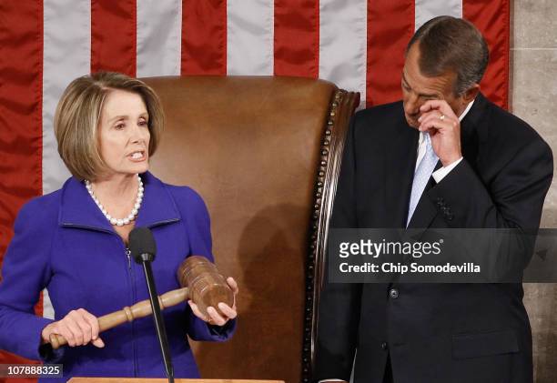 Speaker of the House John Boehner wipes his eyes as outgoing Speaker of the House Nancy Pelosi prepares to hand over over the Speaker's gavel...