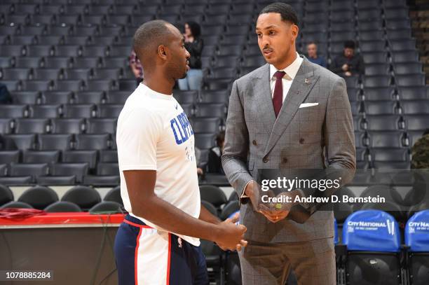 Luc Mbah a Moute of the LA Clippers talks to Ryan Hollins before the game against the San Antonio Spurs on December 29, 2018 at STAPLES Center in Los...