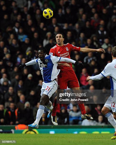 Sotirios Kyrgiakos of Liverpool goes up with Benjani of Blackburn Rovers during a Barclays Premier League match between Blackburn Rovers and...