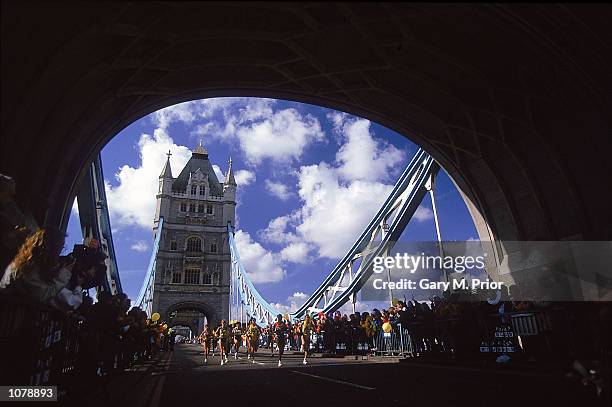 Runners cross Tower Bridge in the 2000 Flora London Marathon in London, England. Mandatory Credit: Gary M. Prior/Allsport