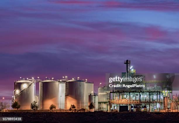 sunset photography of a biodiesel factory - biodiesel stock pictures, royalty-free photos & images