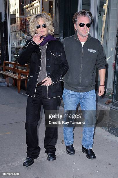 Actress Meg Ryan and singer John Mellencamp leave E.A.T. Restaurant on January 5, 2011 in New York City.