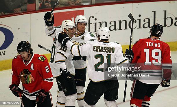 Brenden Morrow, Brad Richards and Loui Eriksson of the Dallas Stars celebrate Morrows' 1st period goal as Duncan Kieth and Jonathan Toews of the...