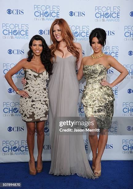 Personalities Kourtney Kardashian, Khloe Kardashian, and Kim Kardashian pose with the Favorite TV Guilty Pleasure Award in the press room during the...