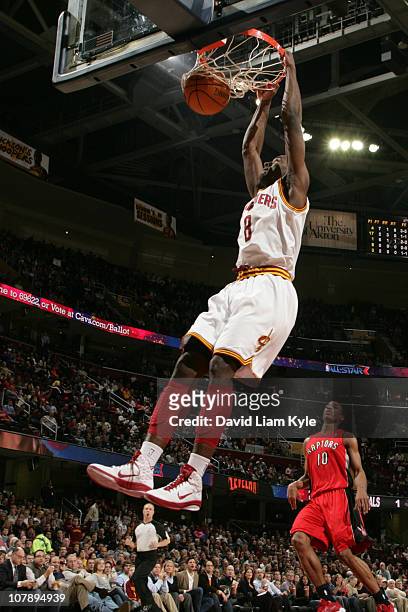 Christian Eyenga of the Cleveland Cavaliers dunks against DeMar DeRozan of the Toronto Raptors during the game at The Quicken Loans Arena on January...