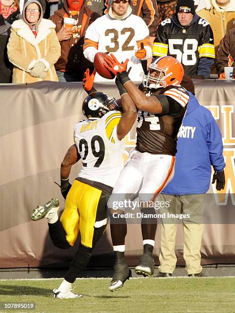 Tight end Robert Royal of the Cleveland Browns attempts catch a pass in the endzone while defensive back Ryan Mundy of the Pittsburgh Steelers...