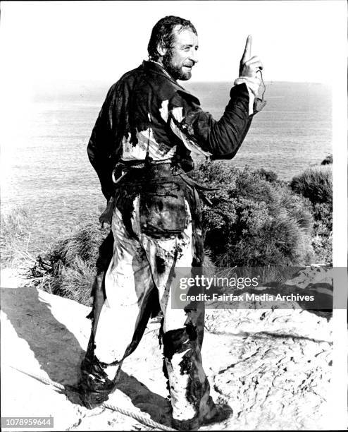 Stunt man Grant Page, soaked in petrol, leaped over North Head ablaze today and survived. Page, completely enveloped in fire leapt from the cliff top...