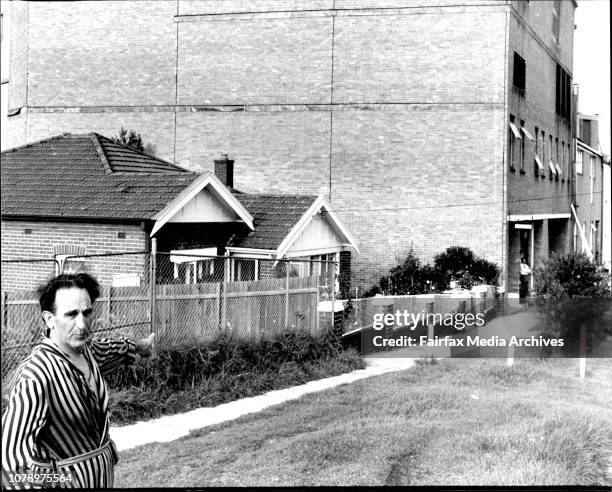 Mr. Cosmas Perry outside his home in Wallace Street, Randwick, next door to the South Sydney Junior Rugby League which he has been arguing with for...