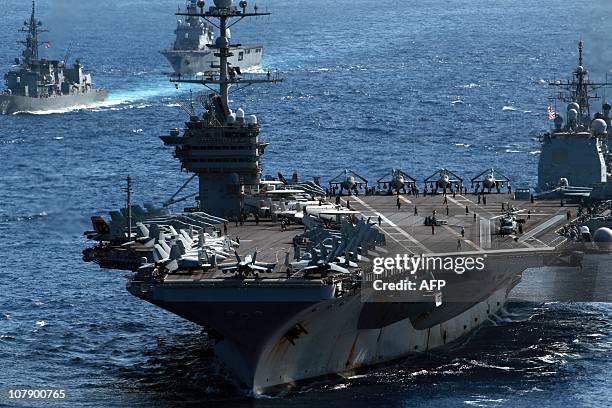 Aircraft carrier USS George Washington sails among US and Japanese warships during the Keen Sword US-Japan military exercises in the Pacific Ocean on...