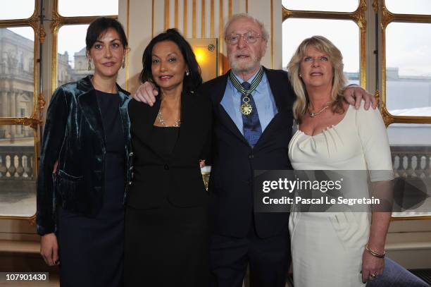 Actor Sir Michael Caine poses with daughters Natasha and Dominique and his wife Shakira after being awarded "Commandeur des arts et des lettres" by...