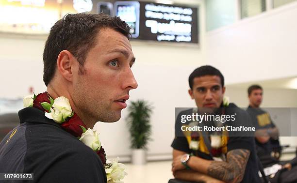 Scott McDonald and Tim Cahill of the Australian Socceroos arrive at the Doha International Airport on January 6, 2011 in Doha, Qatar.