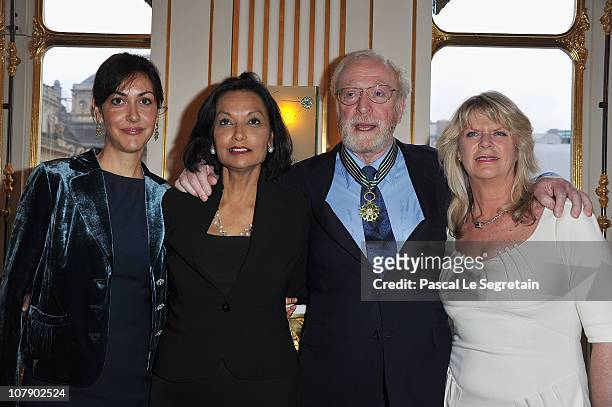 Actor Sir Michael Caine poses with daughters Natasha and Dominique and his wife Shakira after being awarded "Commandeur des arts et des lettres" by...