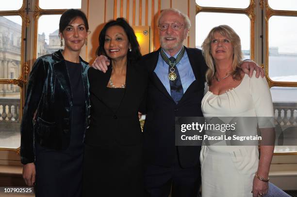 Actor Sir Michael Caine poses with daughters Natasha and Dominique and his wife Shakira after being awarded "Commandeur des arts et des lettres" by...