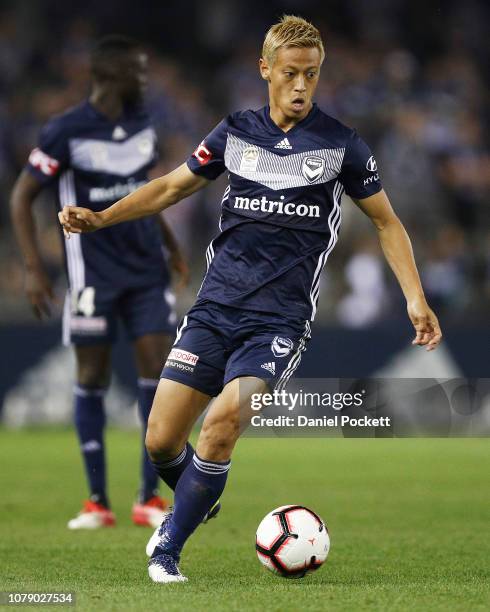 Keisuke Honda of the Victory runs with the ball during the round seven A-League match between Melbourne Victory and Adelaide United at Marvel Stadium...
