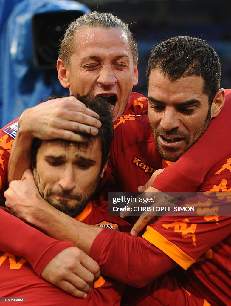 AS Roma's forward Mirko Vucinic (L) cele