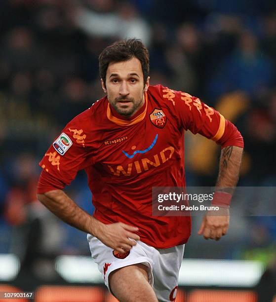 Mirko Vucinic of AS Roma celebrates after scoring the third goal during the Serie A match between AS Roma and Catania Calcio at Stadio Olimpico on...