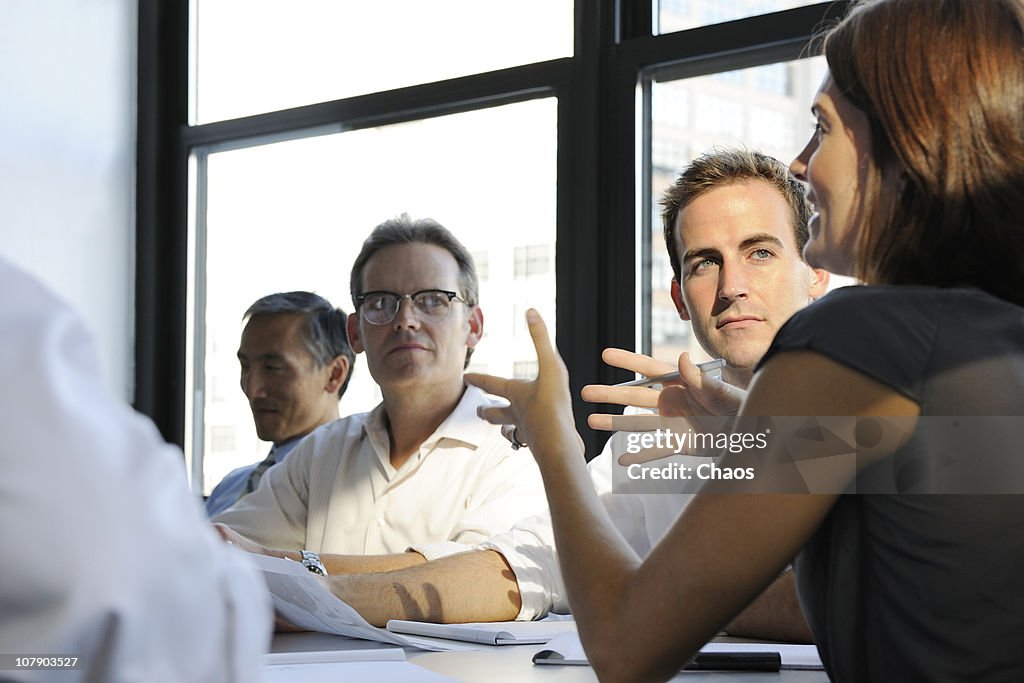 Woman business person holding a company meeting