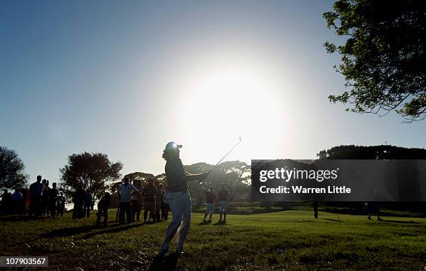 Thomas Aiken of South Africa plays his seocnd shot into the 15th green during the first round of the Africa Open at East London GC on January 6, 2011...