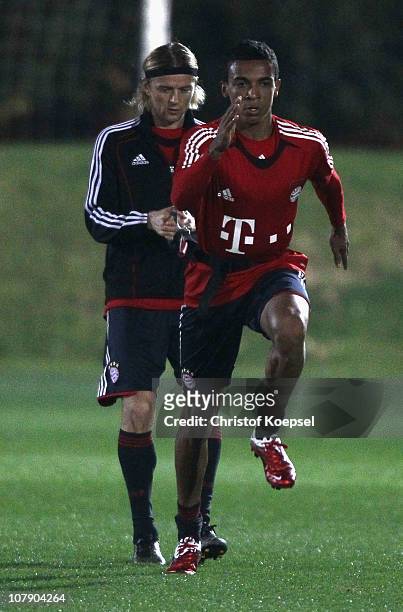 Luiz Gustavo of Bayern pulls Anatoliy Tymoshchuk of Bayern during the FC Bayern Muenchen training session at Aspire Academy for Sports Excellence...