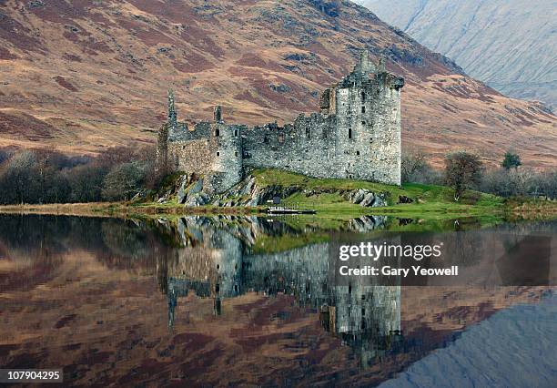 castle reflected in a loch - loch awe bildbanksfoton och bilder