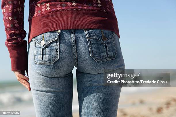 woman's back side, close-up - beach bum foto e immagini stock