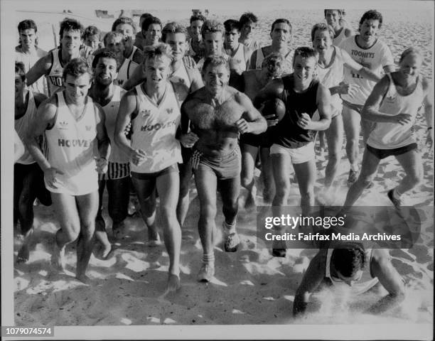 Sydney Swans training on Bronte beach today.David Bolton gives, Greg Williams a friendly Shove.A bare chested Tom Hafey leads on their beach...