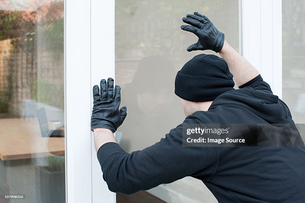 Burglar looking through window