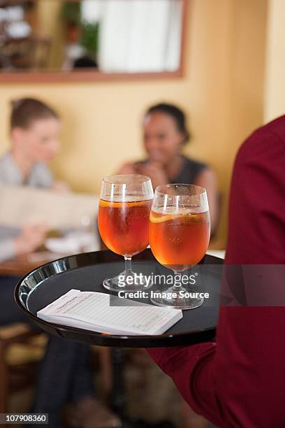 waiter serving drinks - waiter new york stock pictures, royalty-free photos & images