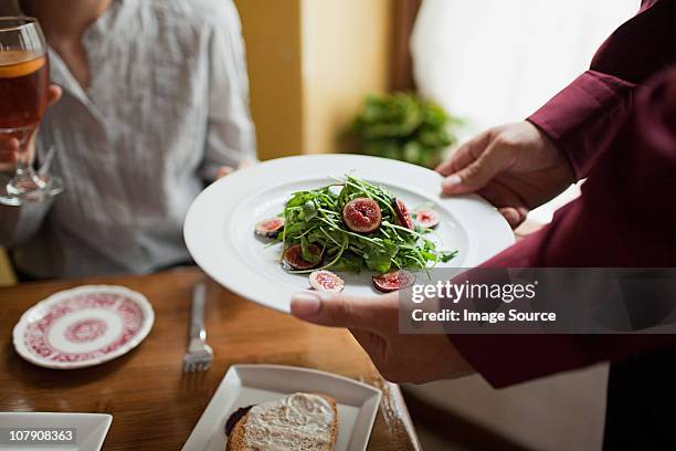 waiter serving plate of salad - waiter new york stock pictures, royalty-free photos & images