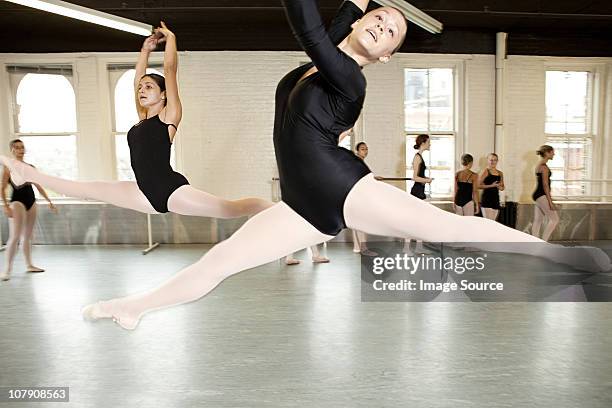 ballerinas jumping - leotard and tights stock pictures, royalty-free photos & images