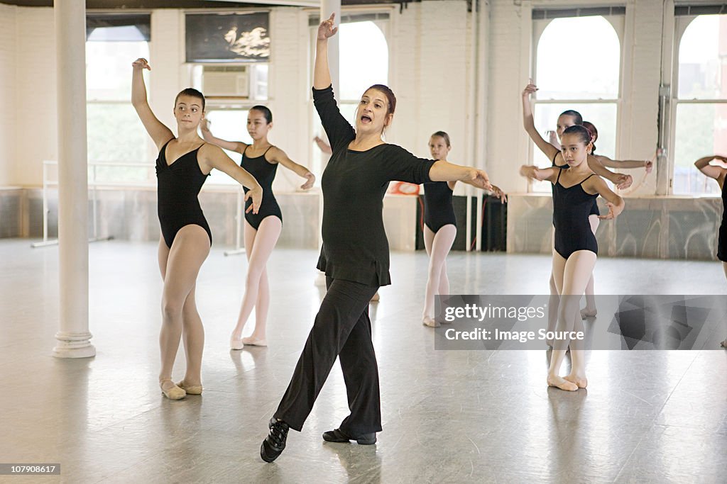 Teacher and ballet dancers
