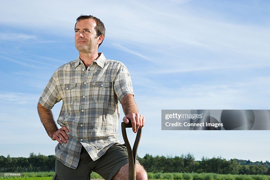 Farmer standing in field